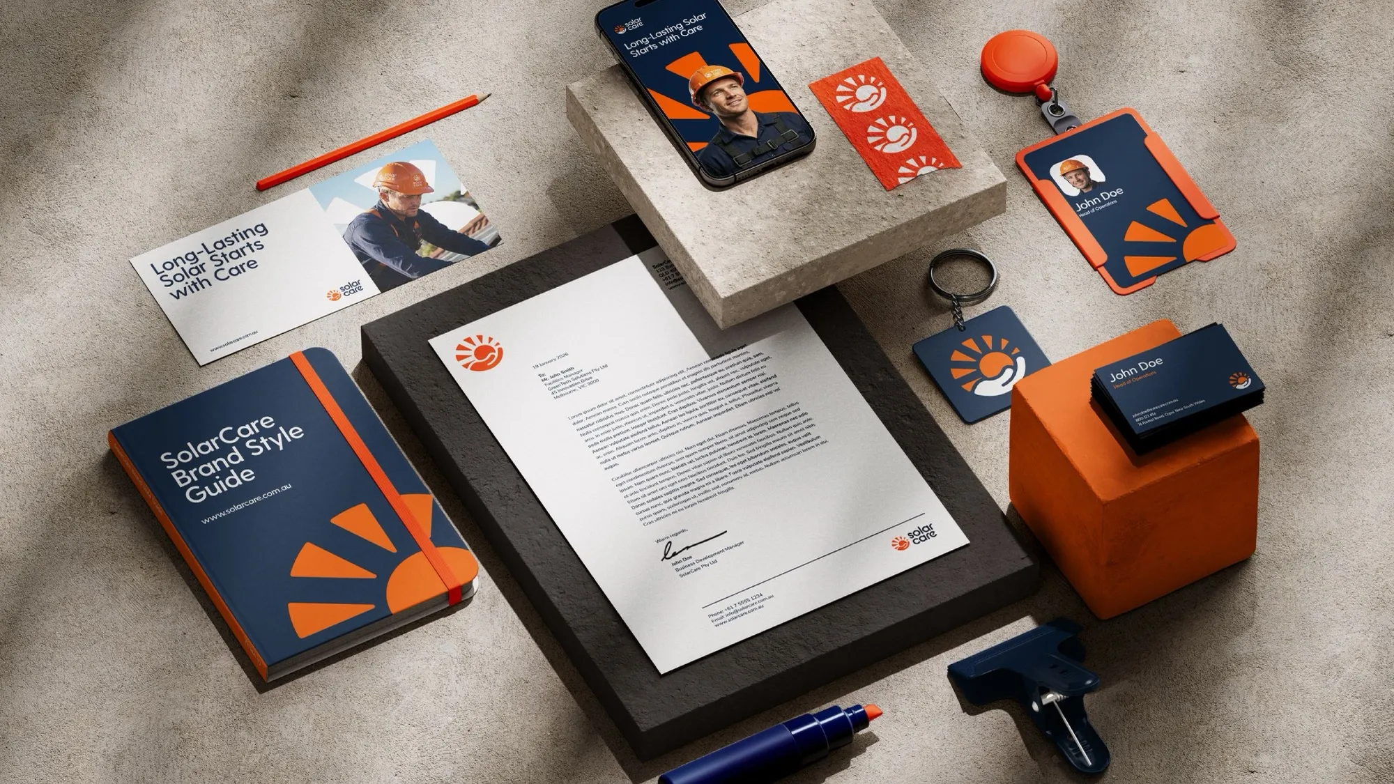 Solar Care brand kit showing stationery, business cards, a staff ID badge, phone screen and branded tools.
