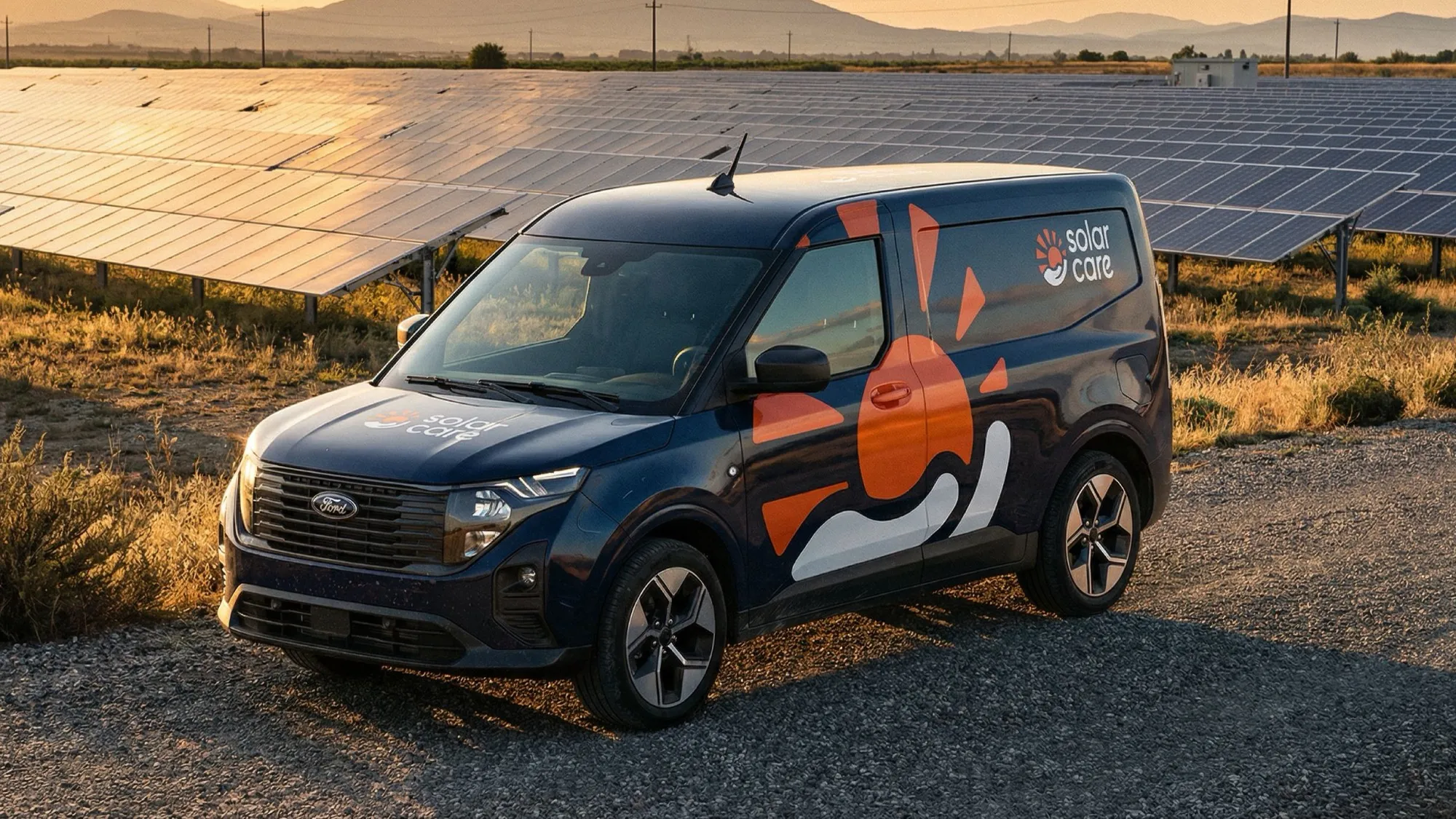 Solar Care branded van parked beside a solar farm at sunset.